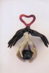 "Hands around the World" pendant, approximately 3 inches.